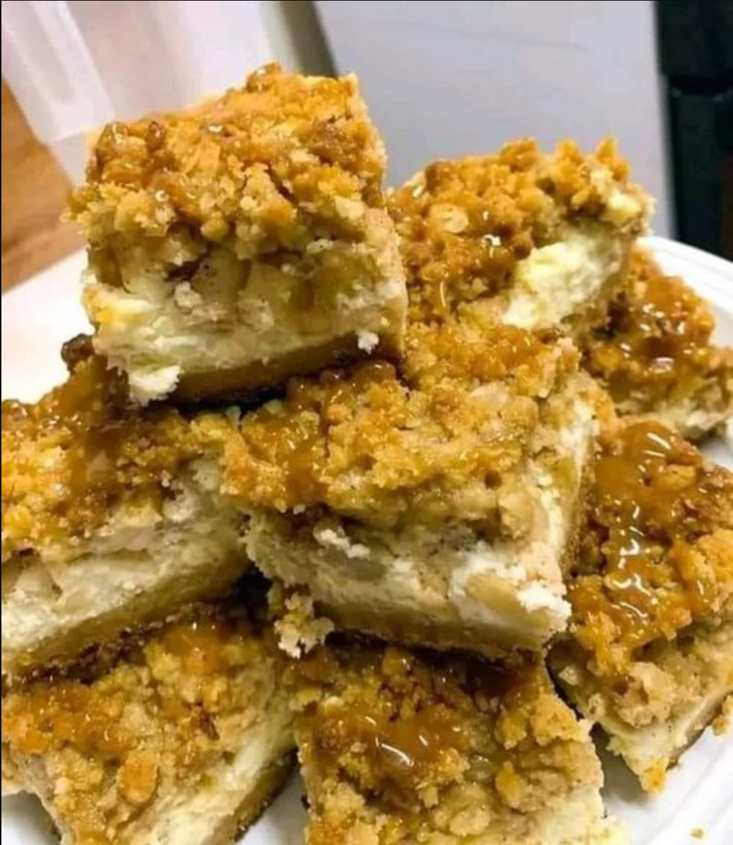 Caramel Apple Cheesecake Bars - A delectable dessert with layers of creamy cheesecake, spiced apples, and buttery streusel, drizzled with caramel sauce.