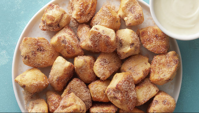 Air Fryer Cinnamon Roll Bites - A plate of golden, bite-sized cinnamon goodness.