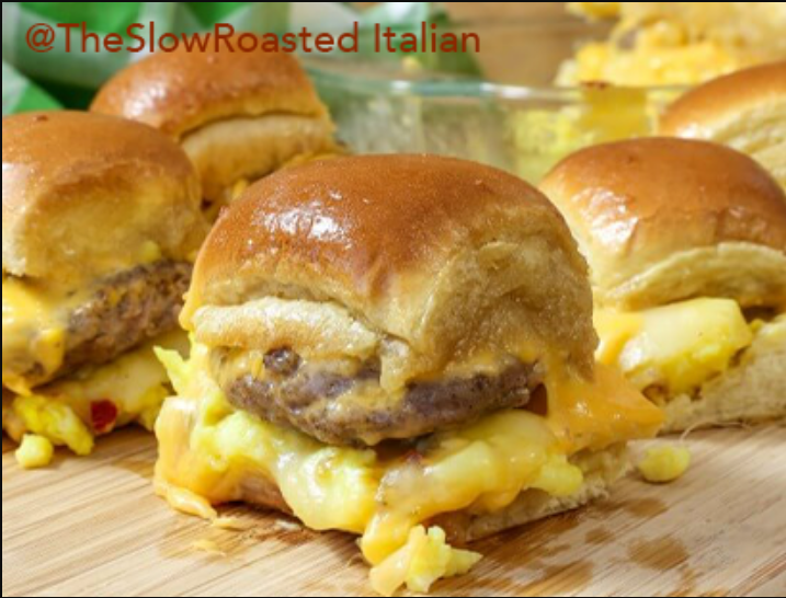 "Breakfast Sliders - A mouthwatering stack of sausage, eggs, and cheese sliders on Hawaiian buns, drizzled with maple-infused butter."