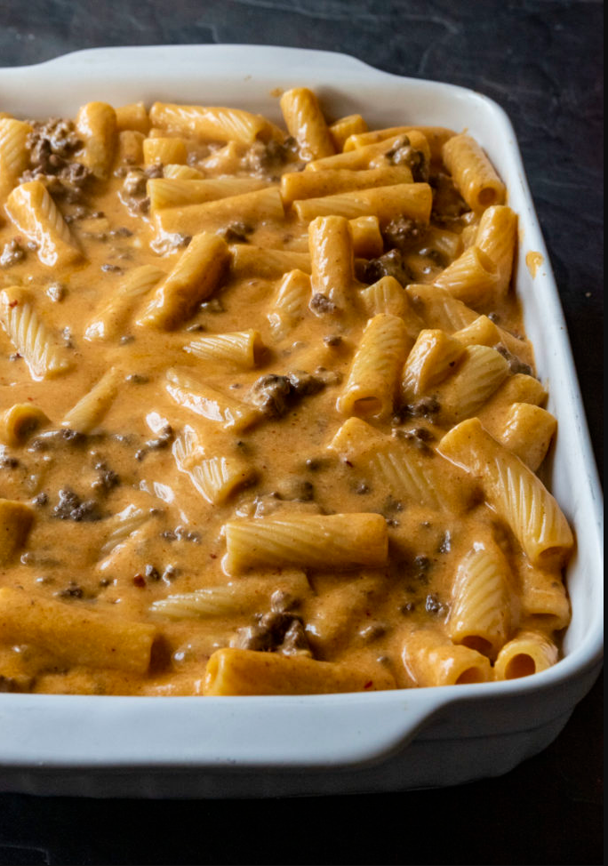 "Cheesy Taco Cream Cheese Pasta - A mouthwatering fusion of ziti noodles, seasoned ground beef, and creamy goodness."