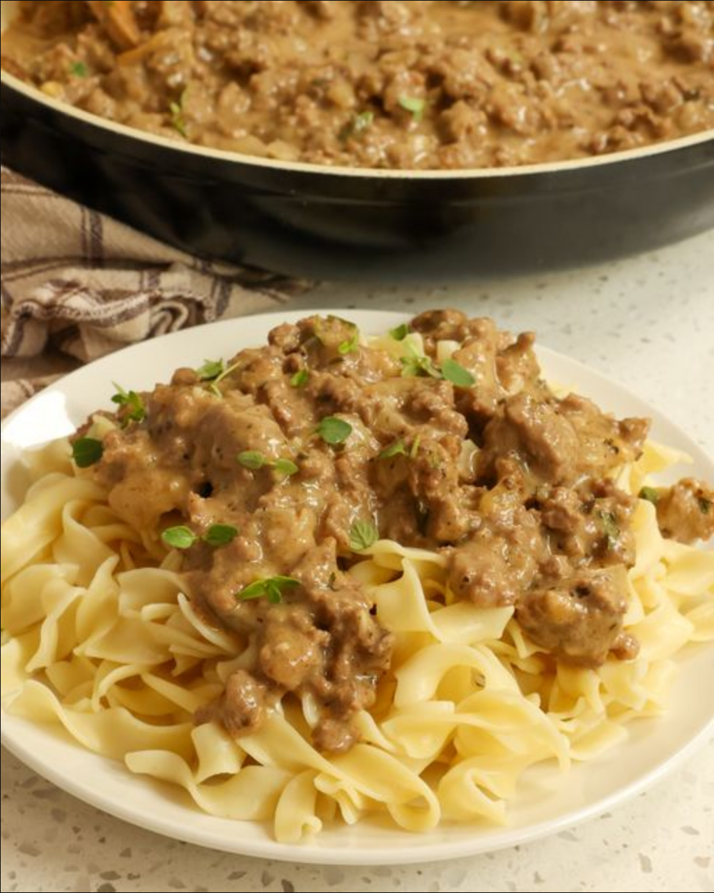 "Hamburger Gravy - A luscious blend of ground beef and creamy brown gravy with aromatic thyme and parsley."