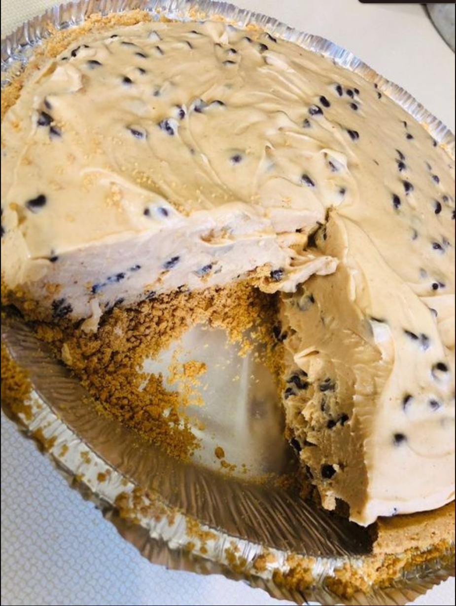 Chocolate Chip Peanut Butter Pie - A decadent treat featuring a chocolate cookie crust, creamy peanut butter filling, and topped with whipped cream and mini chocolate chips.