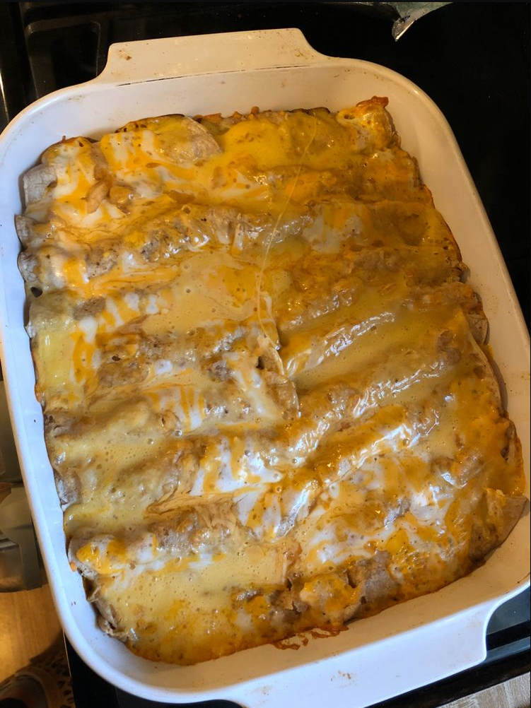 Tex-Mex Beef Enchiladas: Rolled tortillas filled with seasoned beef, topped with homemade sauce and melted cheddar cheese.