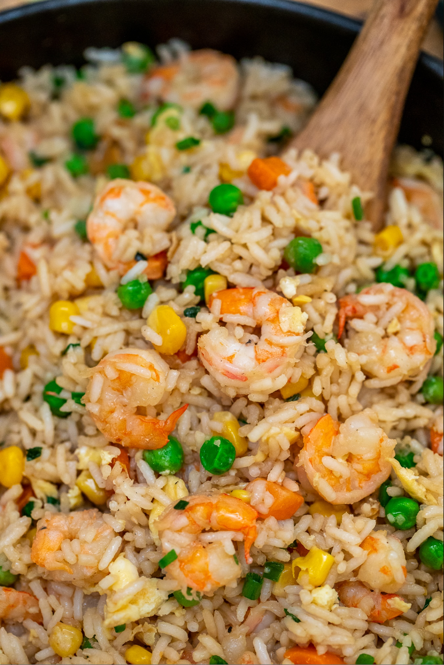 "Delicious shrimp fried rice served in a bowl, garnished with green onions."