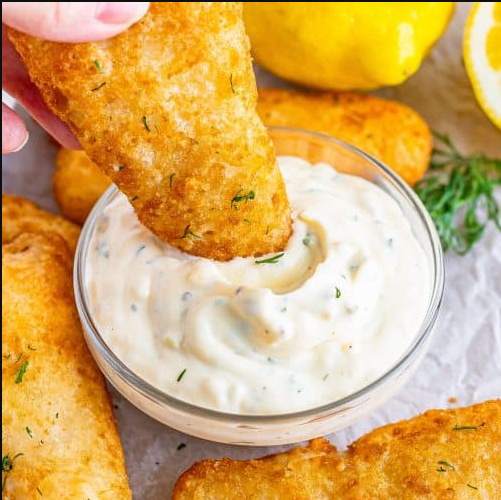 Homemade Tartar Sauce - A bowl of creamy tartar sauce adorned with dill, capers, and a lemon wedge, ready to enhance the seafood experience.