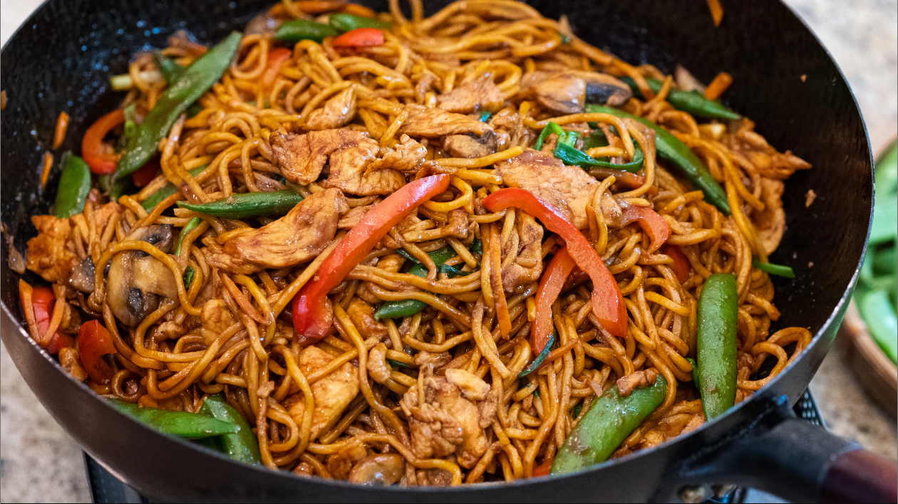 Chicken Lo Mein - A delicious stir-fried noodle dish with marinated chicken, colorful veggies, and a mouthwatering soy-based sauce.