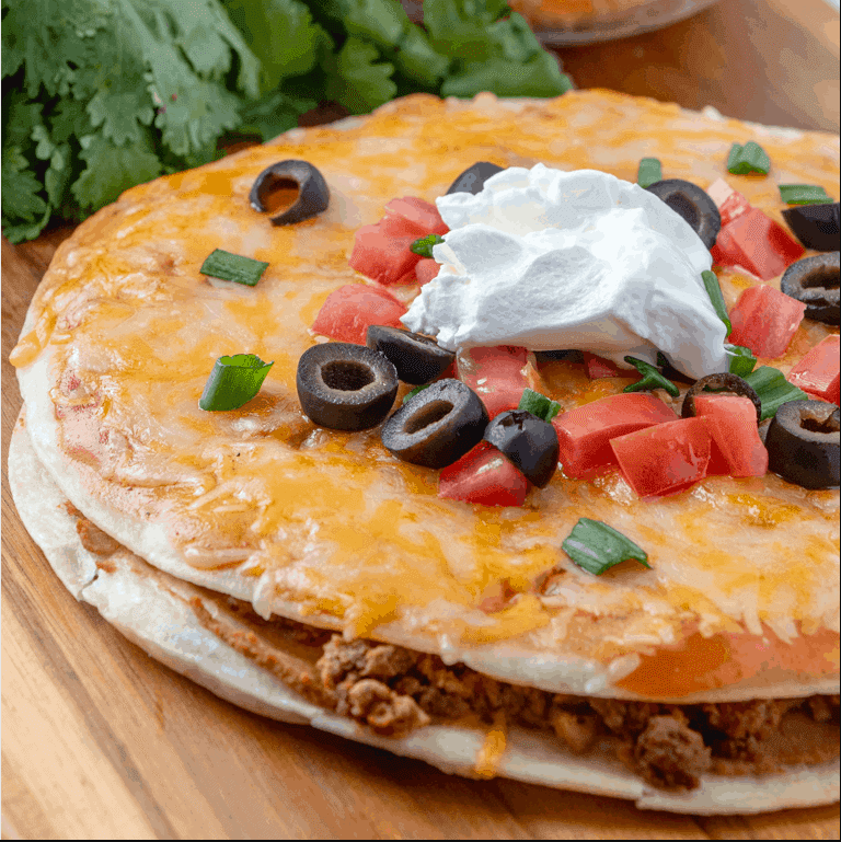 Double-Decker Mexican Pizzas - Crispy fried corn tortillas stacked with taco-seasoned beef, refried beans, and melted cheese.