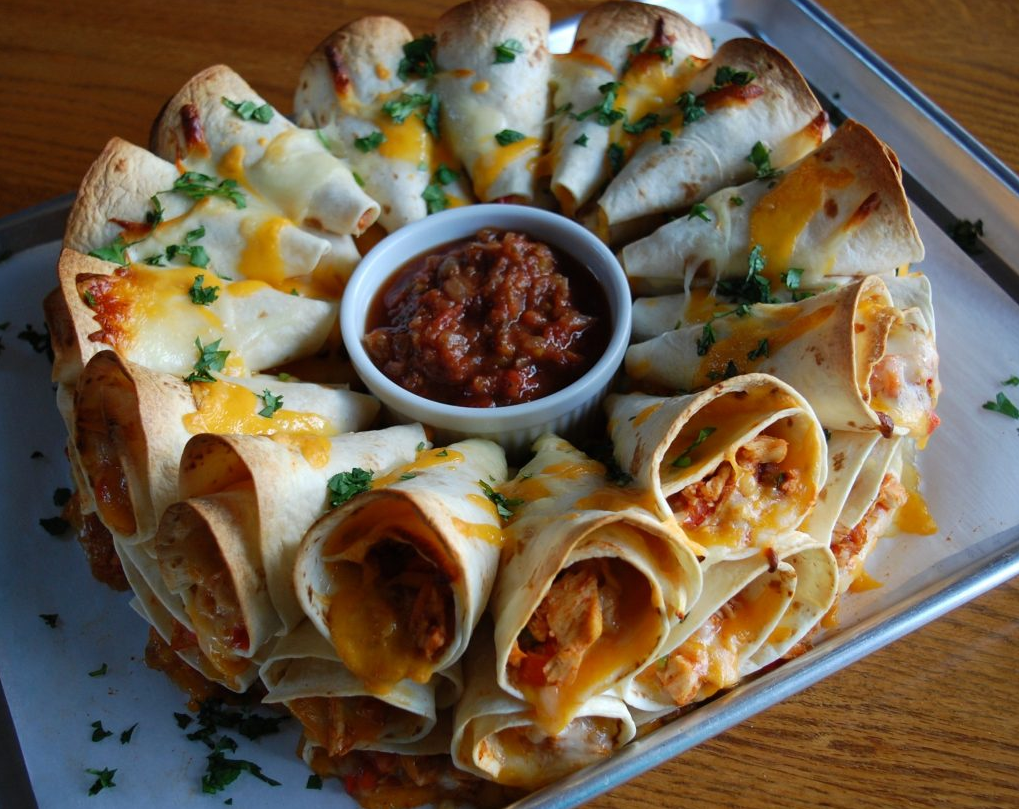 Blooming Quesadilla Ring - A mesmerizing arrangement of tortilla cones filled with chicken, cheese, and veggies, baked to perfection.