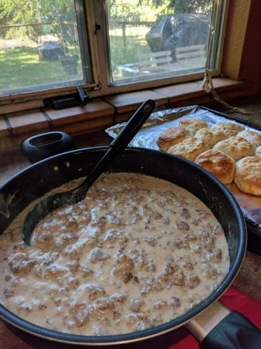 Pioneer Woman Sausage Gravy - A spoonful of rich and flavorful sausage gravy over warm biscuits.