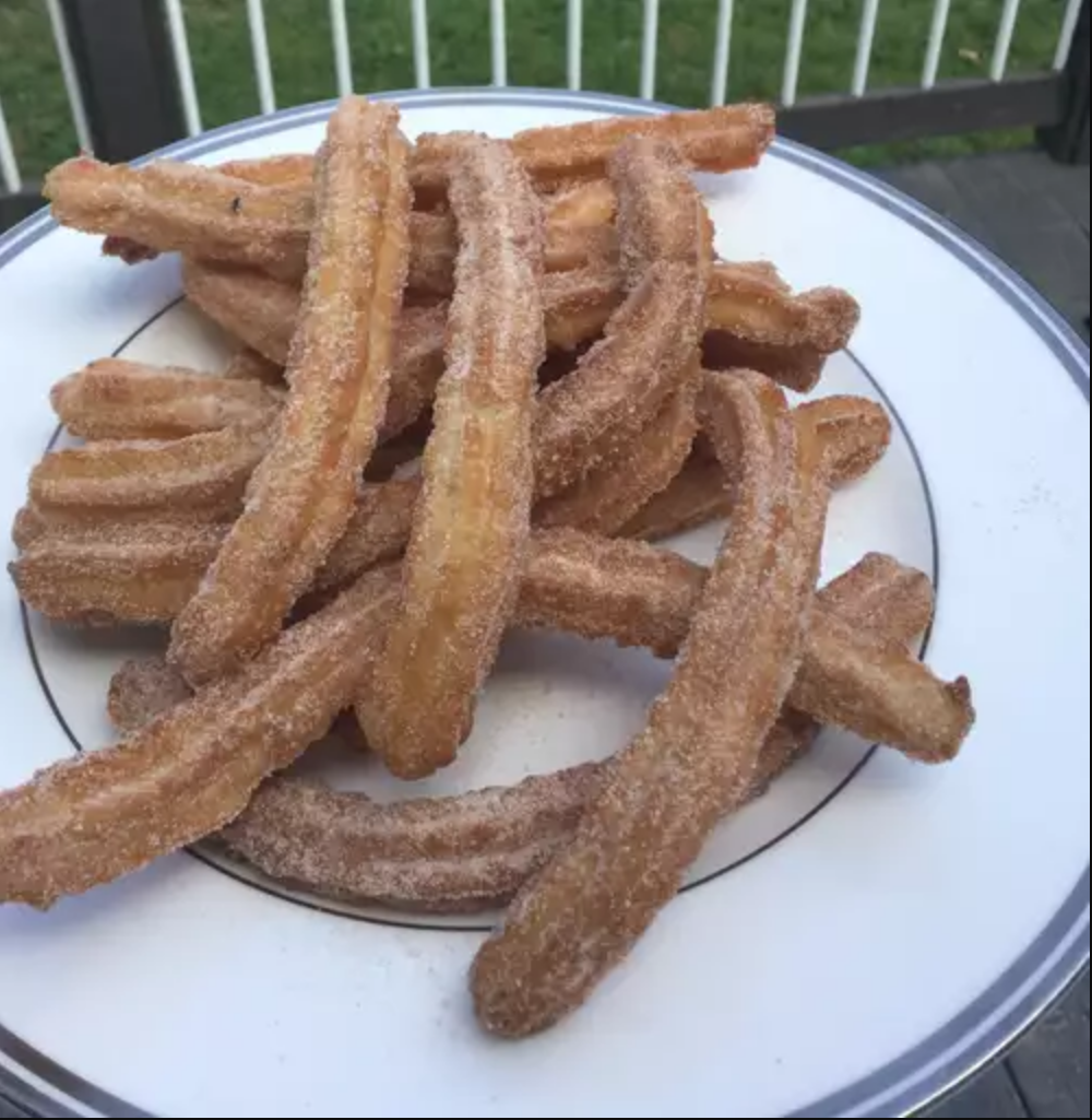 Golden Churros served with chocolate sauce