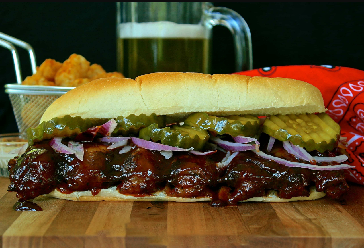 Homemade McRib Sandwich with pickles and onions