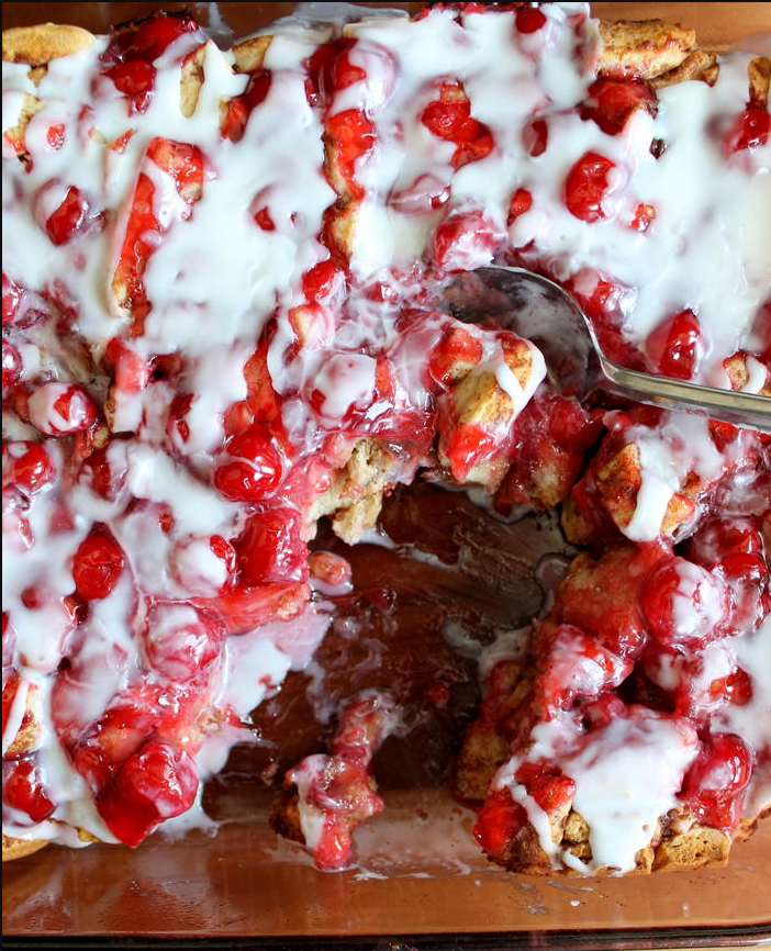 Cinnamon Roll Cherry Pie Bake – Gooey cinnamon rolls topped with a luscious layer of cherry pie filling, drizzled with icing for a sweet finish.