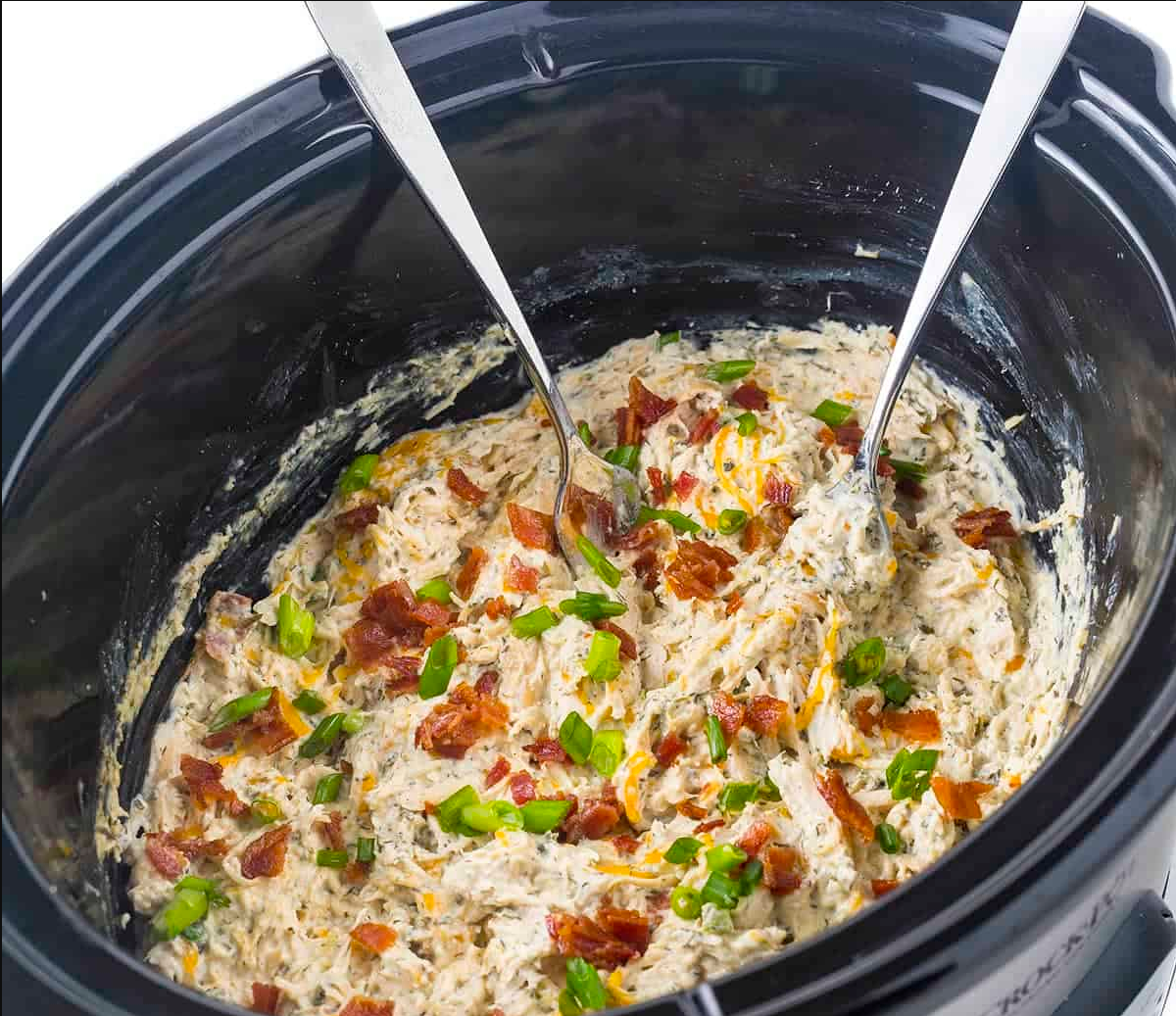 Slow Cooker Cream Cheese Crack Chicken - A delicious ensemble of chicken, cream cheese, and bacon on toasted hoagie rolls.