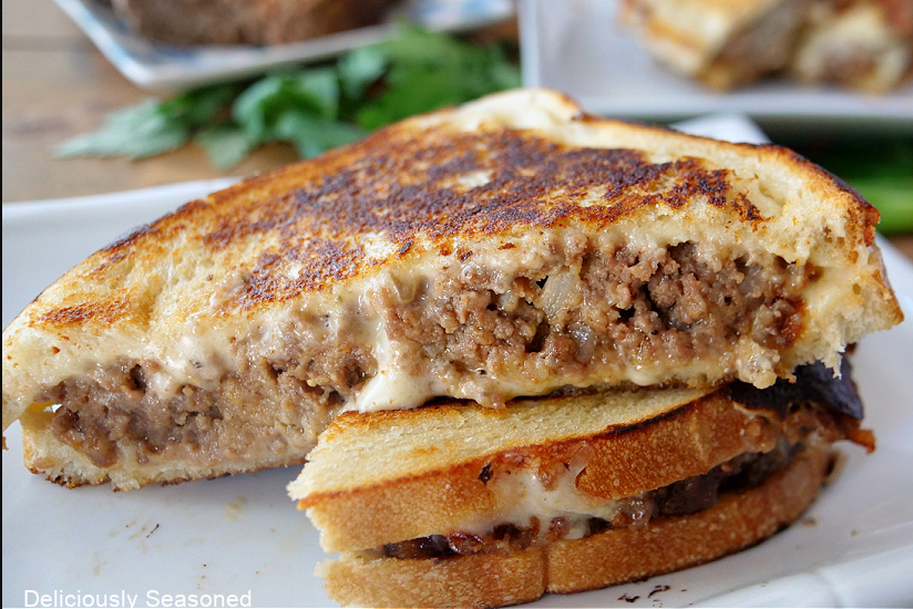 "Delicious Meatloaf Grilled Cheese sandwich with melted cheddar and mozzarella, a tempting treat for your taste buds."